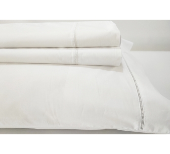 Top sheet with pillows in...